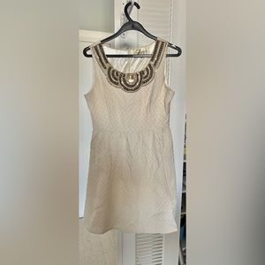 Cream mini dress with beaded/sequin neckline. Great condition. Worn 2x.